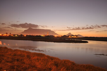 Table Mountain Panoramic Landscape with Beautiful Colorful Sunset and Streaking Clouds Landscape,...