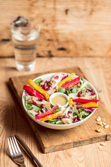 Salad with chicken nuts and pomegranate