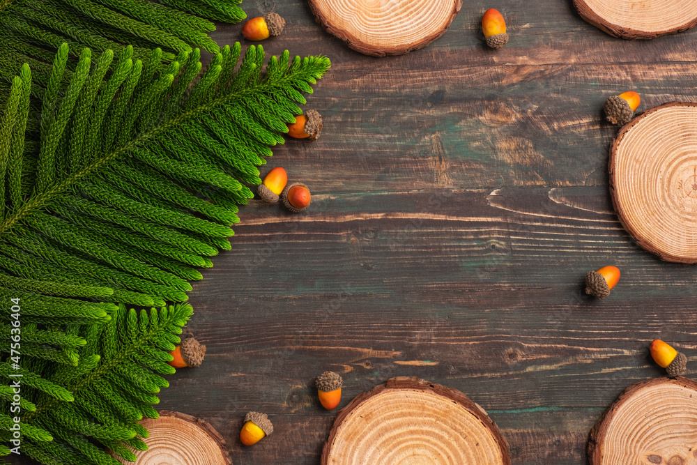 Poster christmas pine tree and pine cone on woooden table background