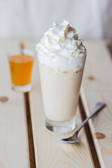 Mango iced latte with whipped cream