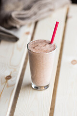 Iced chocolate chip cookie milkshake smoothie in a tall glass