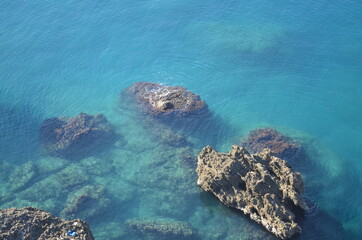 Fototapeta na wymiar stones in the sea and on the shore