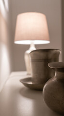 Vertical shot of the old metallic bowls and lampshade
