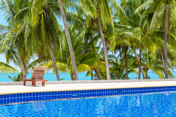 Swimming pool blue water, sea beach poolside, tropical island nature, green palm trees, ocean coast...