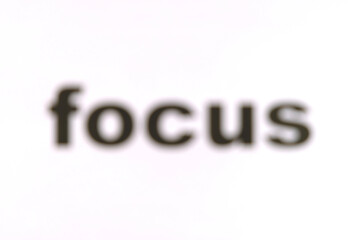 The word 'focus' intentionally blurred, unwittingly drawing viewers to focus on it. Blurry 'focus'...