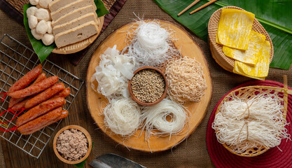 Different variety of noodles and meatball and asian sweet sausage.