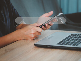 Searching for information with modern technology Man's hand using phone to search for information...