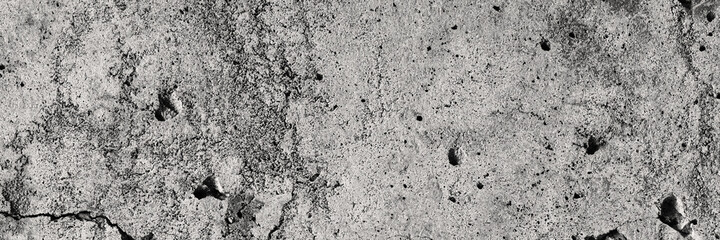 Texture of old cracked concrete wall. Rough gray concrete surface. Wide panoramic background for...
