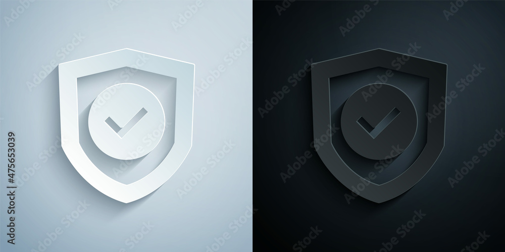 Poster paper cut shield with check mark icon isolated on grey and black background. protection symbol. secu
