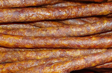 many smoked homemade sausages in closeup