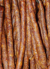 many smoked homemade sausages in closeup