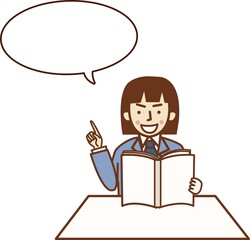 本を読みながら指を差すスーツ姿の女性。