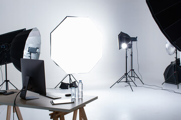Nobody in empty photographer photography shooting studio workplace set full of equipment flash...