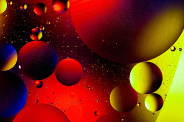 Abstract colorful background of oil circles. Oil in circles on the water surface, water foam and...