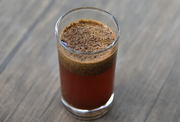 a cup of arabica coffee ready to be enjoyed with a blur background