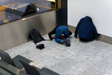 Muslim praying at Zürich Airport on a foggy winter day. Photo taken December 17th, 2021, Zurich,...