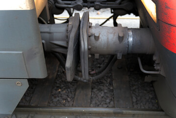 Close-up of train coupling at railway station on a foggy winter day. Photo taken December 17th, 2021, Zurich, Switzerland.