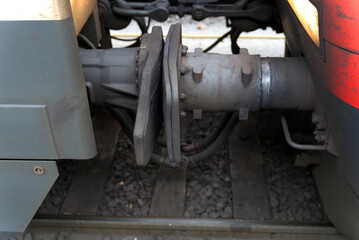 Fototapeta premium Close-up of train coupling at railway station on a foggy winter day. Photo taken December 17th, 2021, Zurich, Switzerland.