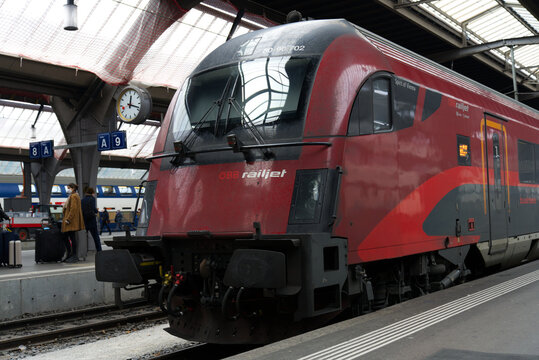 Close-up of &Ouml;BB railjet parked train at Z&uuml;rich main railway station on a foggy winter day. Photo taken December 17th, 2021, Zurich, Switzerland.