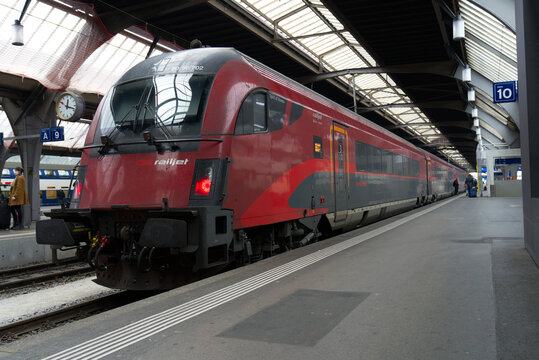 Close-up of &Ouml;BB railjet parked train at Z&uuml;rich main railway station on a foggy winter day. Photo taken December 17th, 2021, Zurich, Switzerland.
