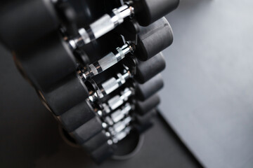 Rack with dumbbells in gym