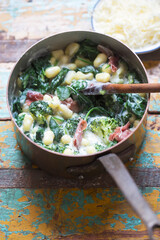 Gnocchi potato dumplings with spinach, broccoli, parma ham and blue cheese sauce