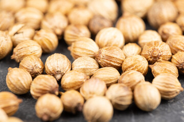 Close up view of true edible spices and seeds: Details of  coriander seeds ( Coriandrum sativum ) with unsharp and sharp areas (DOF)