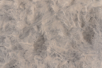 texture sea sand resembles miniature dunes. Minimal beach background. Travel background. Coastal...
