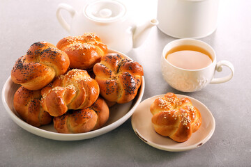 Breakfast seed rolls with cup of green tea