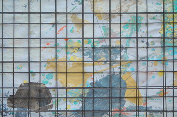 Abstract colorful background. drawing with paint behind bars. ban on arts and painting and graffiti