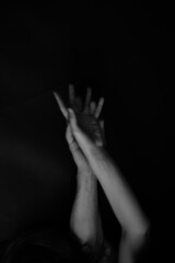 Fototapeta premium praying hands on black background