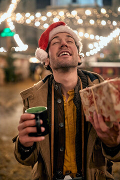 Portrait of a happy caucasian man reciving a gift