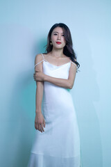 An elegant and dignified woman in a white dress