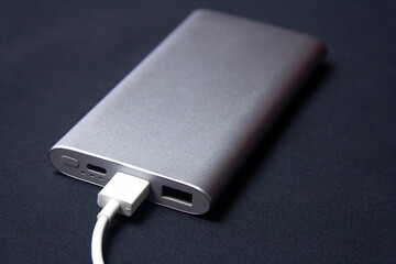 External battery for charging smartphones in silver color