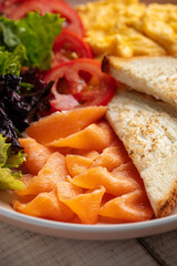 Closeup on gourmet breakfast with salted salmon and omelette