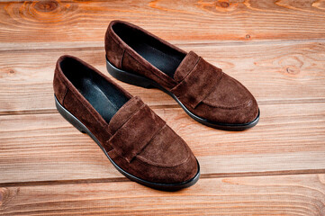 Dark brown suede slippers. Close-up shot.