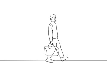 male shopper walks holding a shopping basket - one line drawing vector. shopping concept