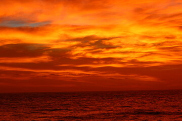 Naklejka na ściany i meble Sunset over the sea