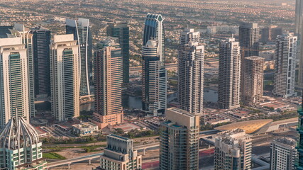 Fototapeta premium Jumeirah Lakes Towers district with many skyscrapers along Sheikh Zayed Road aerial timelapse.