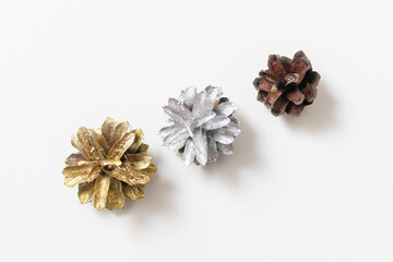 gold, silver and brown cones