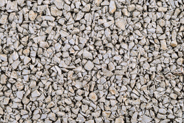 Street pavement made of rubber granular crumb. White granulate close-up.