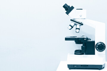 Microscope on the Table in Laboratory Room