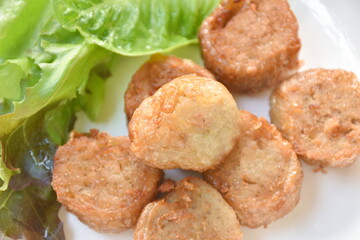 deep fried mashed crab meat and pork roll Chinese food on plate dipping sweet plum sauce