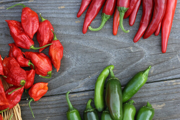 Fresh Peppers outdoors at rural farmers market, Jalapeno, Cayenne and Bhut Jolokia