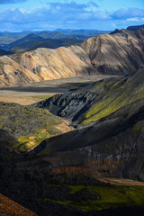 The rugged volcanic landscape of Landmannalaugar as seen from the hiking trail through the Laugahraun lava field at the foot of Brennisteinsalda volcano, Fjallabak Nature Reserve, Iceland	