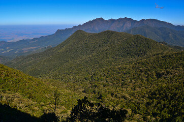 Lush rainforest slopes and the Serra Fina massif on the way to the high sector of Itatiaia National Park, Itatiaia, Rio de Janeiro, Brazil