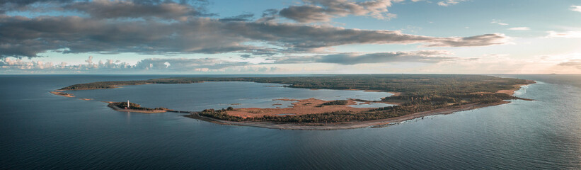 Coast and lighthouse Lange Erik on north coast of the island of Öland in the east of Sweden from above during sunset.