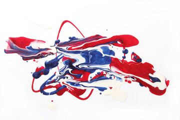 Red, White and Blue Nail Polish Spilled on White Background