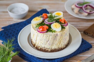 Snack, round Swedish salad cake with herring, potatoes, egg and sour cream mousse on black bread on a light plate on a wooden background. Christmas and Easter recipes.