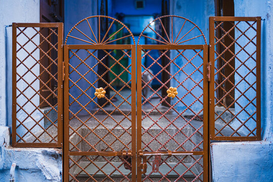 Entrance to an Indian heritage home in the blue district Chandpole of the old city in Jodhpur, Rajasthan, India. 